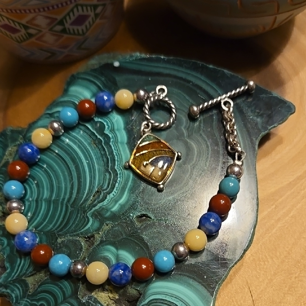 Beaded Bracelet with Silver Charm.
